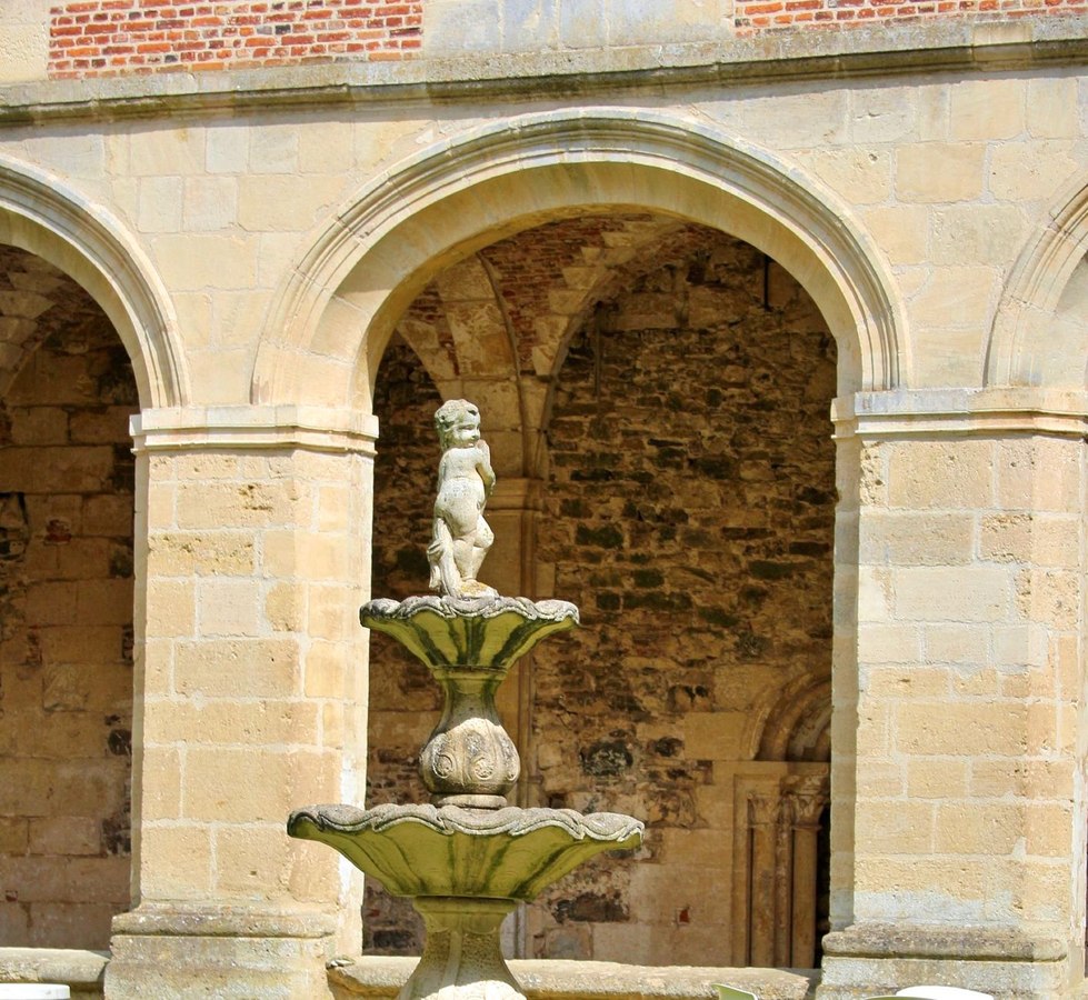 Seville courtyard fountain with traditional blue and white tiles